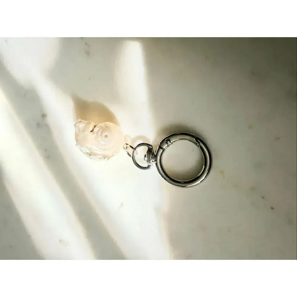 Pearlescent with silver color seashell keychain